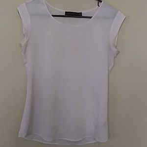 Limited white blouse with no sleeves